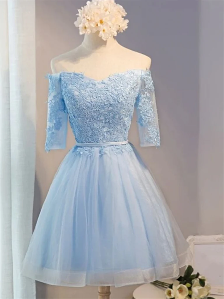 Model wearing an A-line off-shoulder short prom dress with appliques and tulle.