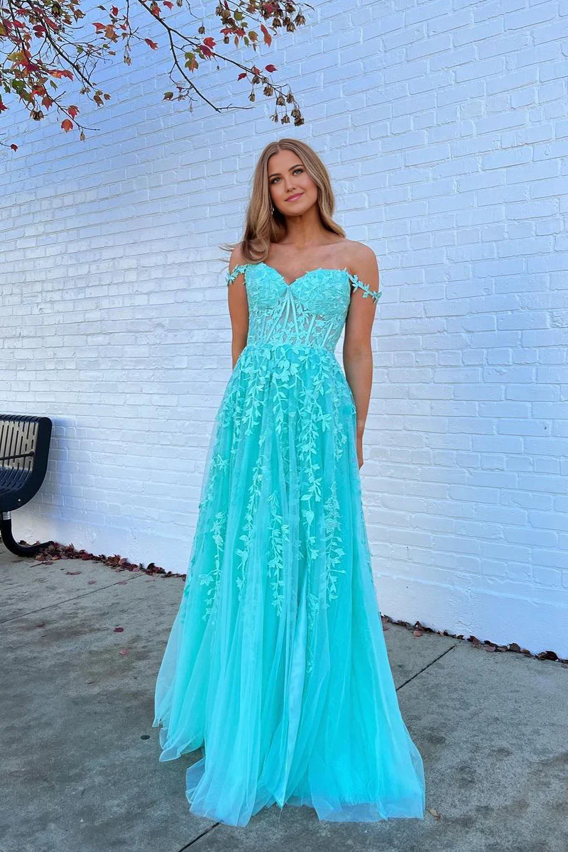 Side view of the teal A-line off-shoulder prom dress, showing appliques.