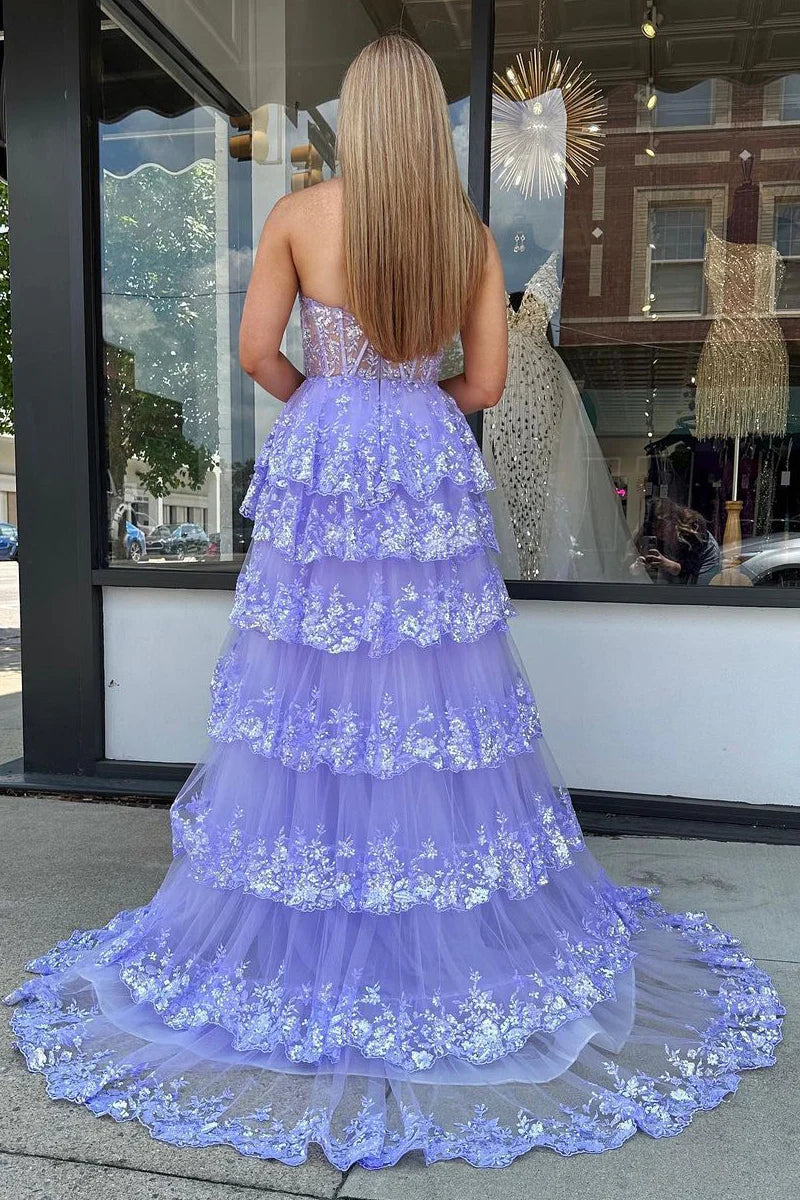 Back view of the elegant lilac tulle A-line prom dress, showcasing the one-shoulder design.