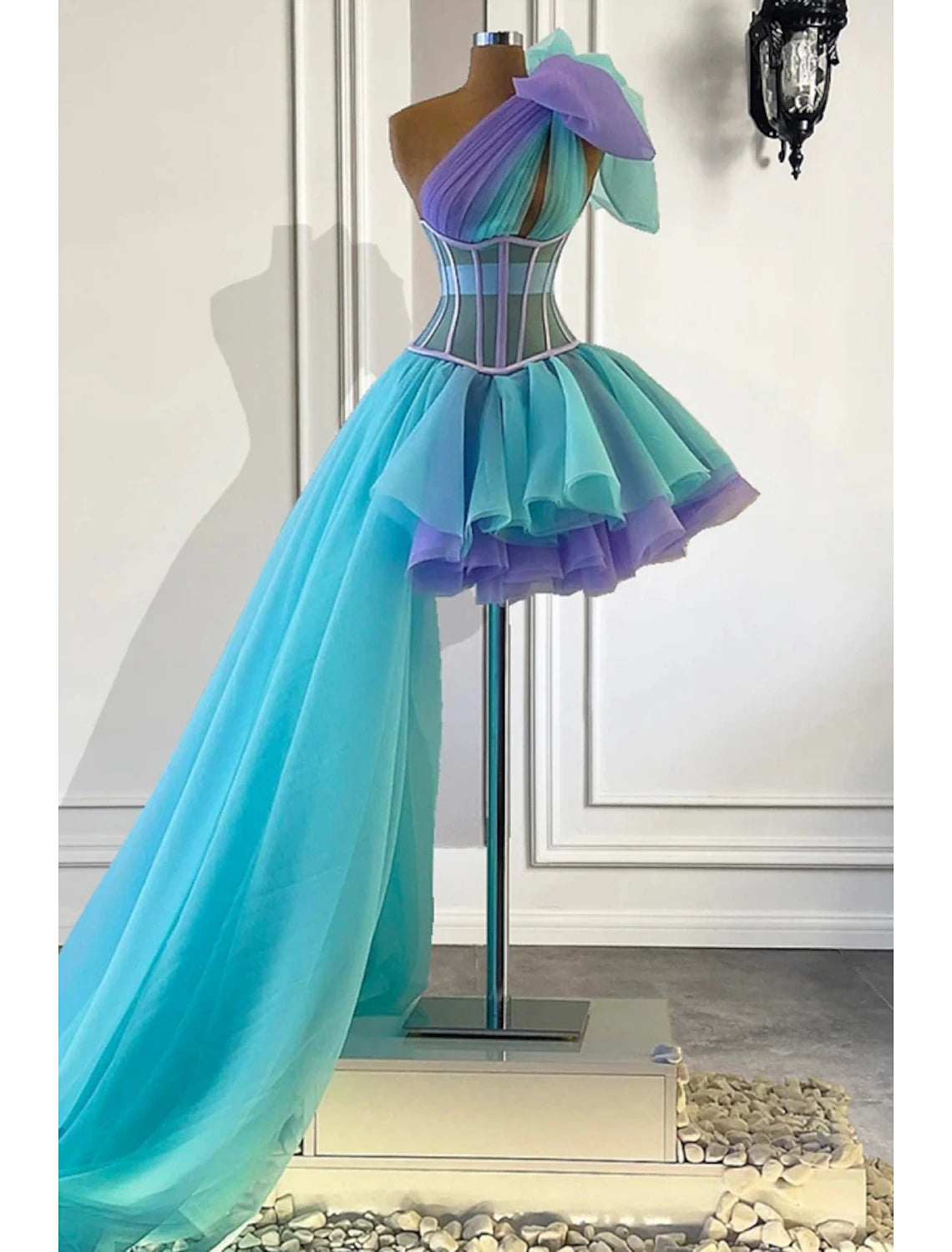Back view of an A-Line one-shoulder Quinceanera dress.