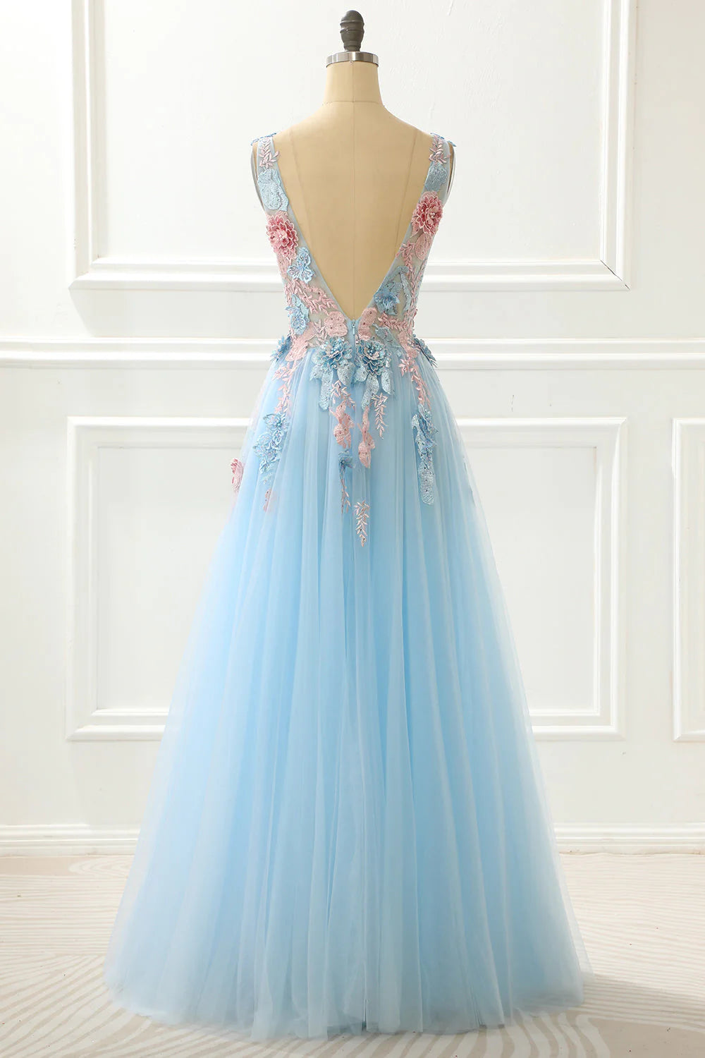 Side view of light blue A-line prom dress with appliques.
