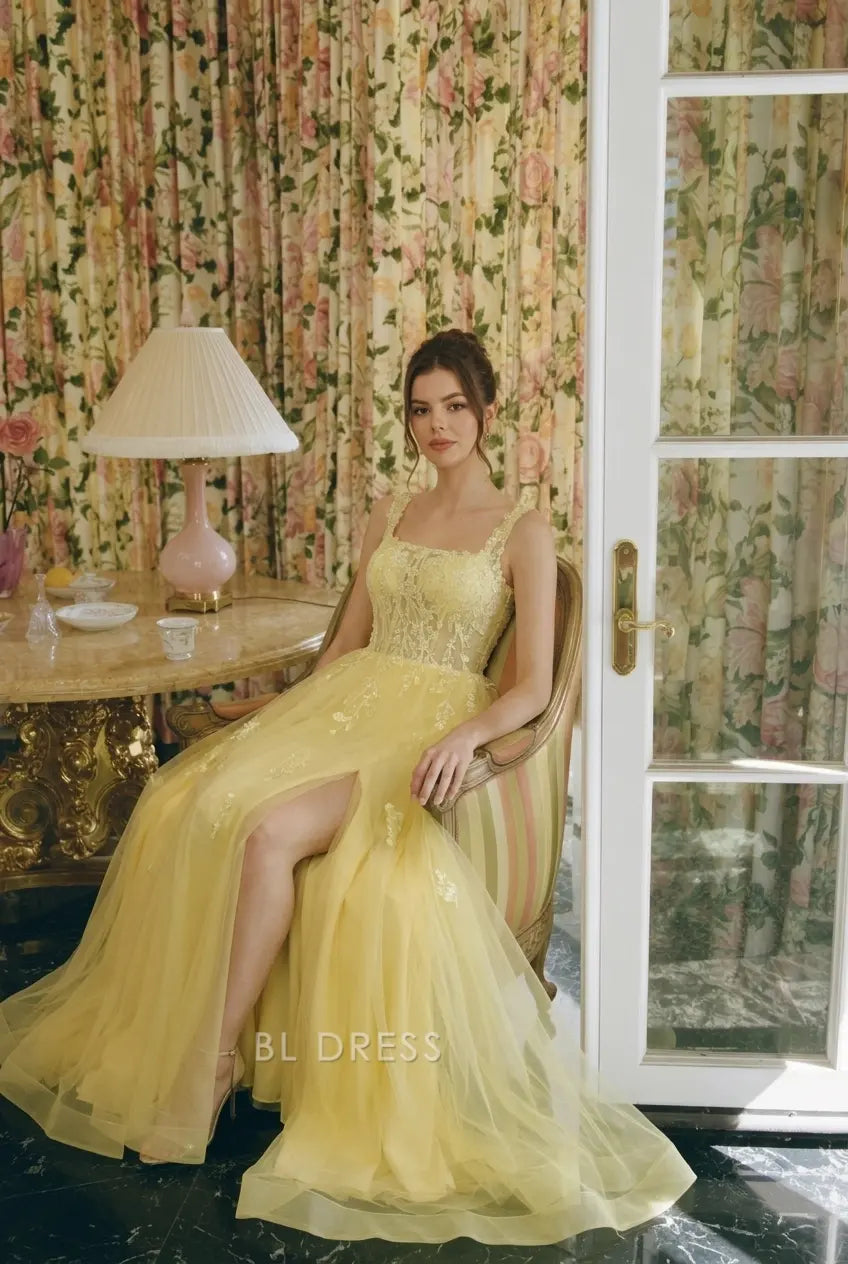 Yellow A-line prom gown with square neck and floral embroidery.