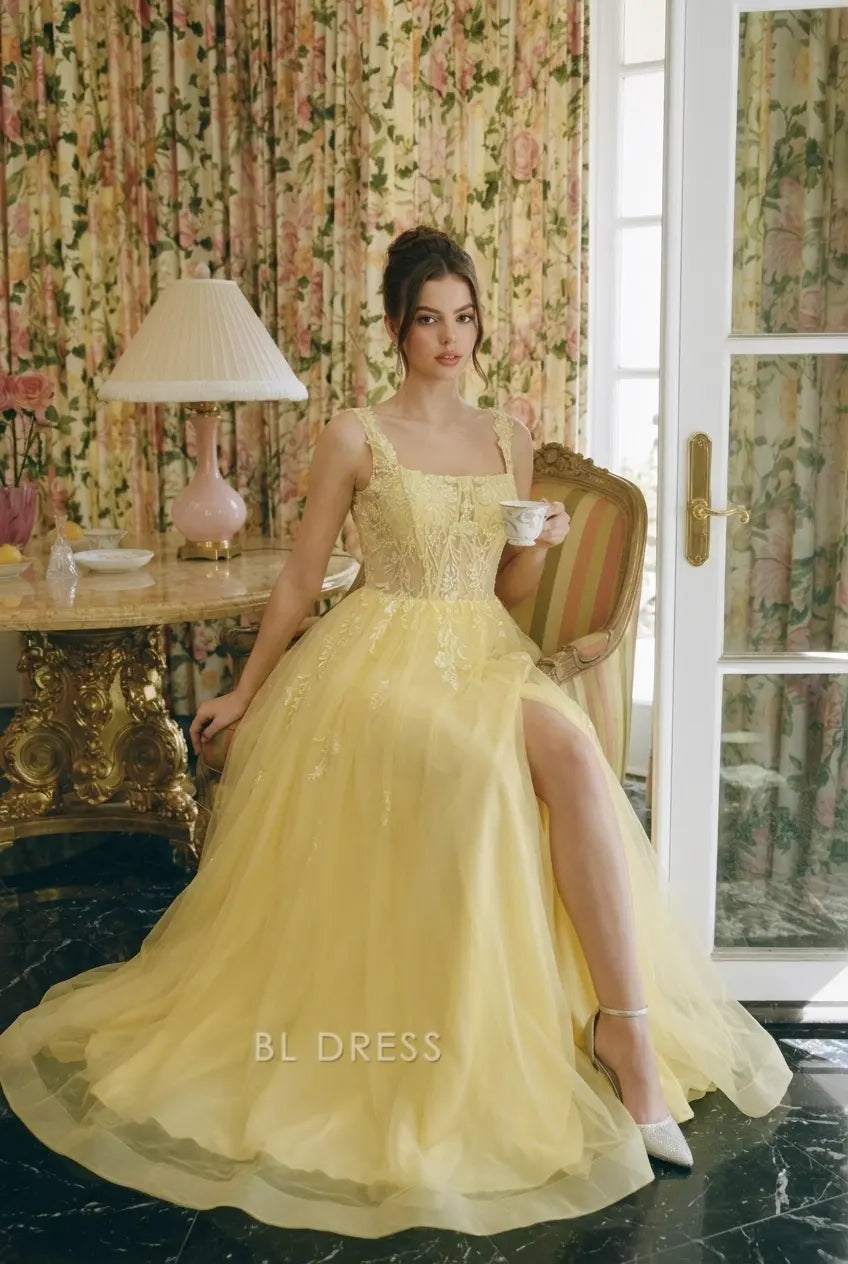 Side view of yellow A-line gown, showing high slit.