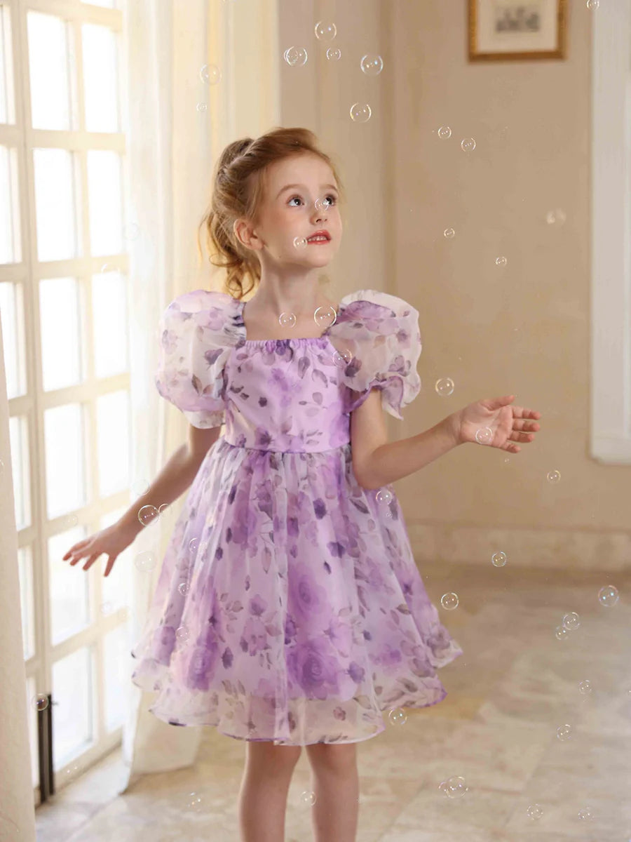 Charming A-line floral flower girl dress with square neck and puff sleeves.