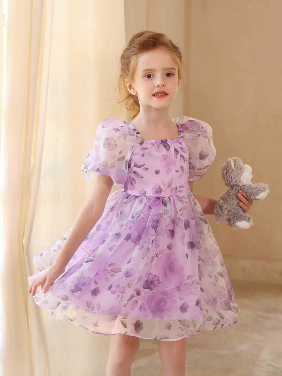 Flower girl dress featuring a square neckline and charming puff sleeves.