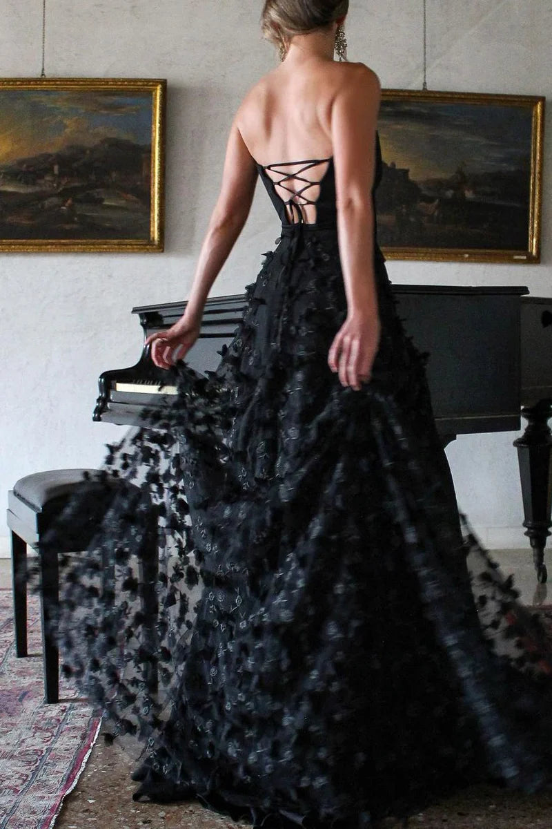 Full length view of the elegant strapless A-line prom dress featuring lace details and a flowing tulle skirt.