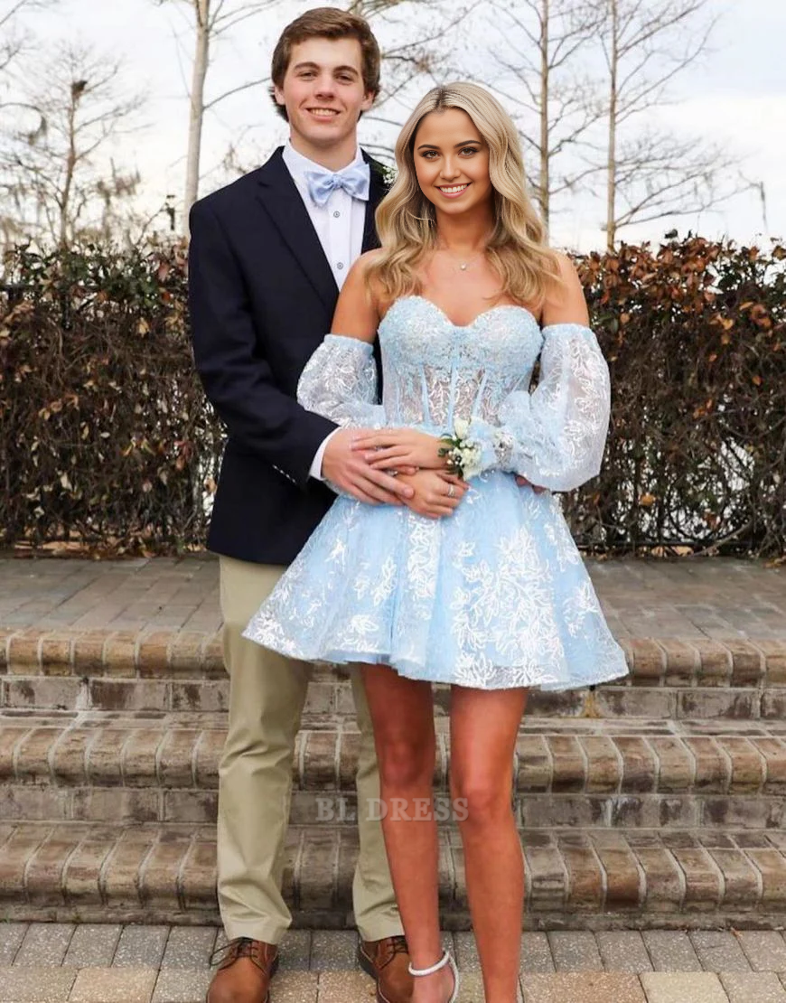 Model wearing a light blue A-line sweetheart formal dress with detachable sleeves.