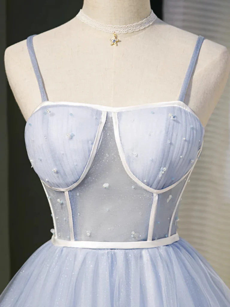 Model showcasing the flowing tulle skirt of a short prom dress.