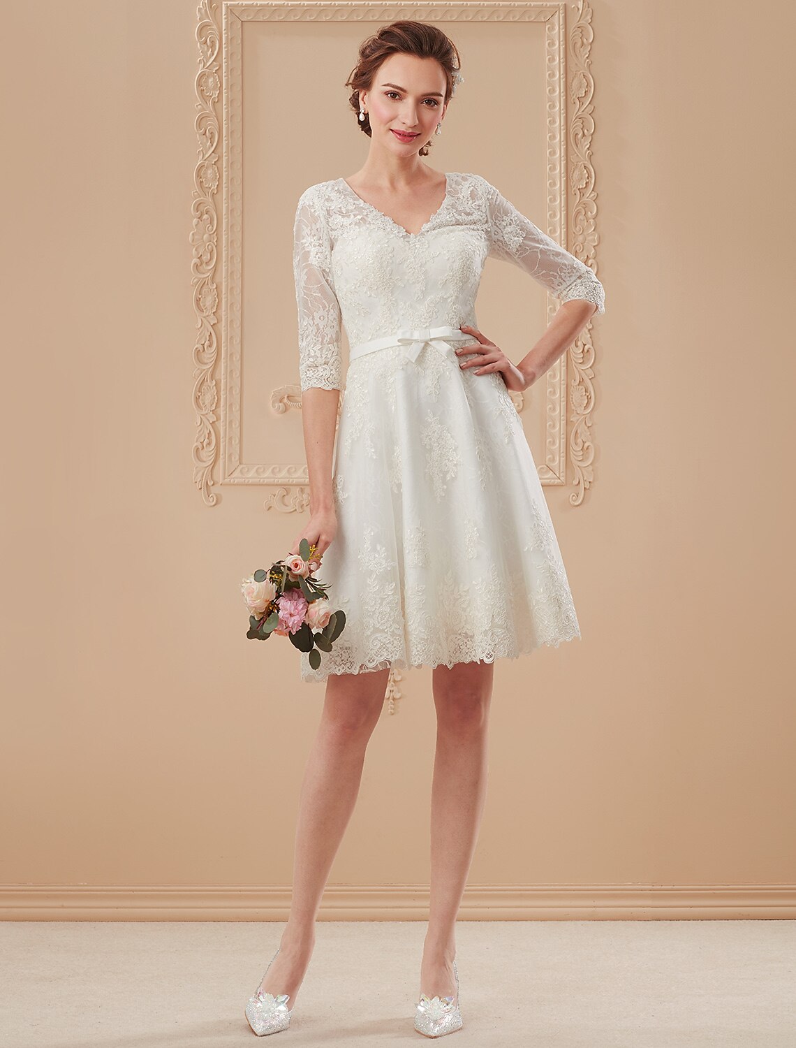 White A-line V-neck lace wedding dress with half sleeves and a bowknot sash.