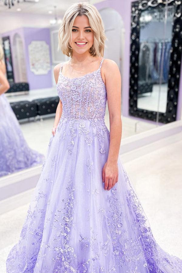 Elegant lilac A-line prom dress with delicate lace appliques and spaghetti straps.