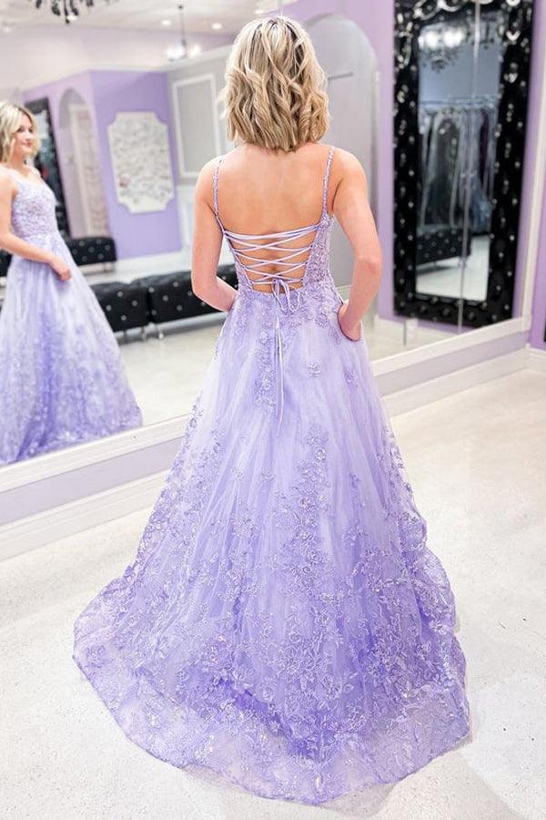 Full length view of a charming lilac A-line gown, featuring lace details and thin straps.