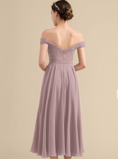Side view of a charming chiffon and lace off-shoulder formal dress.