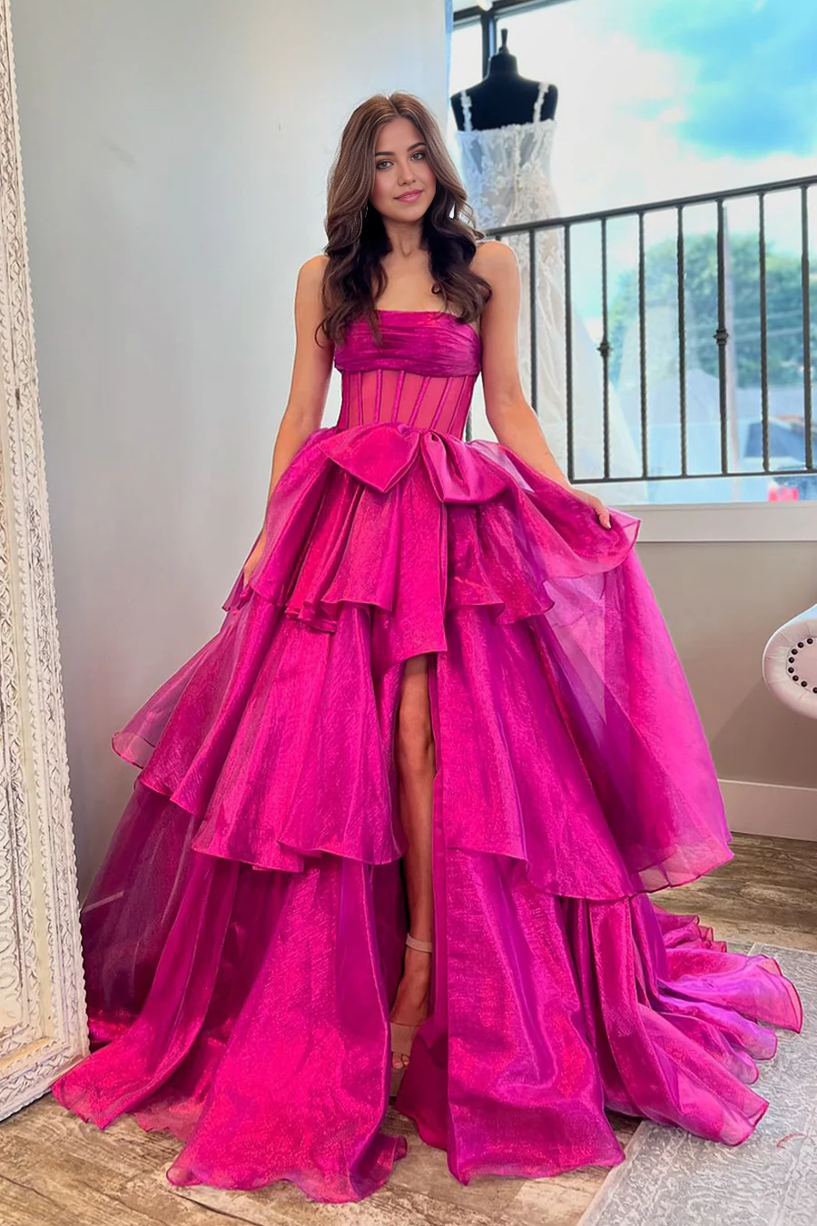 Fuchsia A-line strapless organza ball gown.