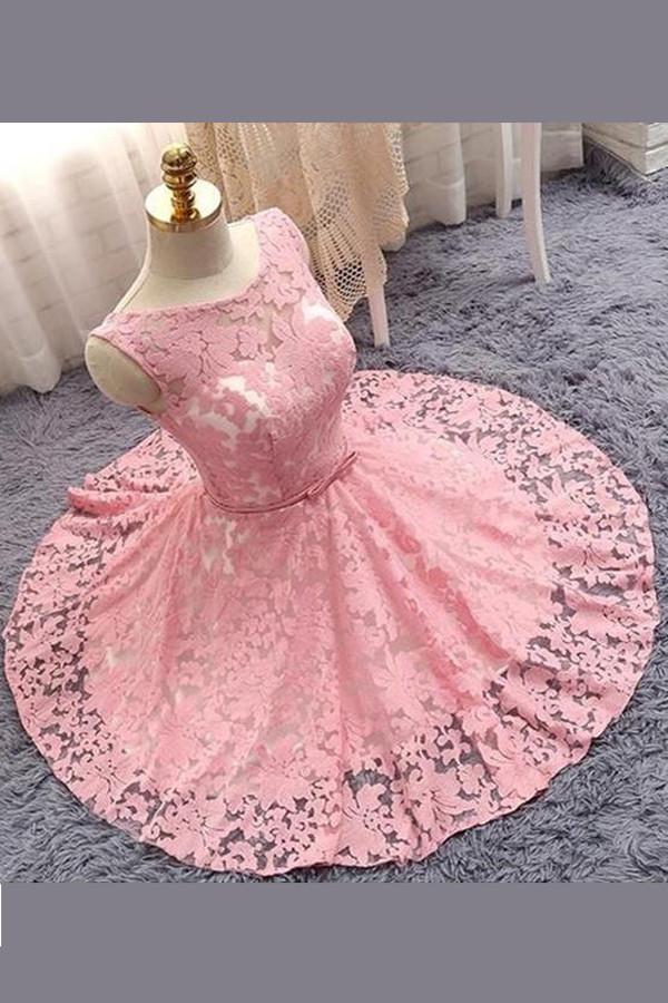 Full view of a light pink A-line V-neck homecoming dress with floral appliques.