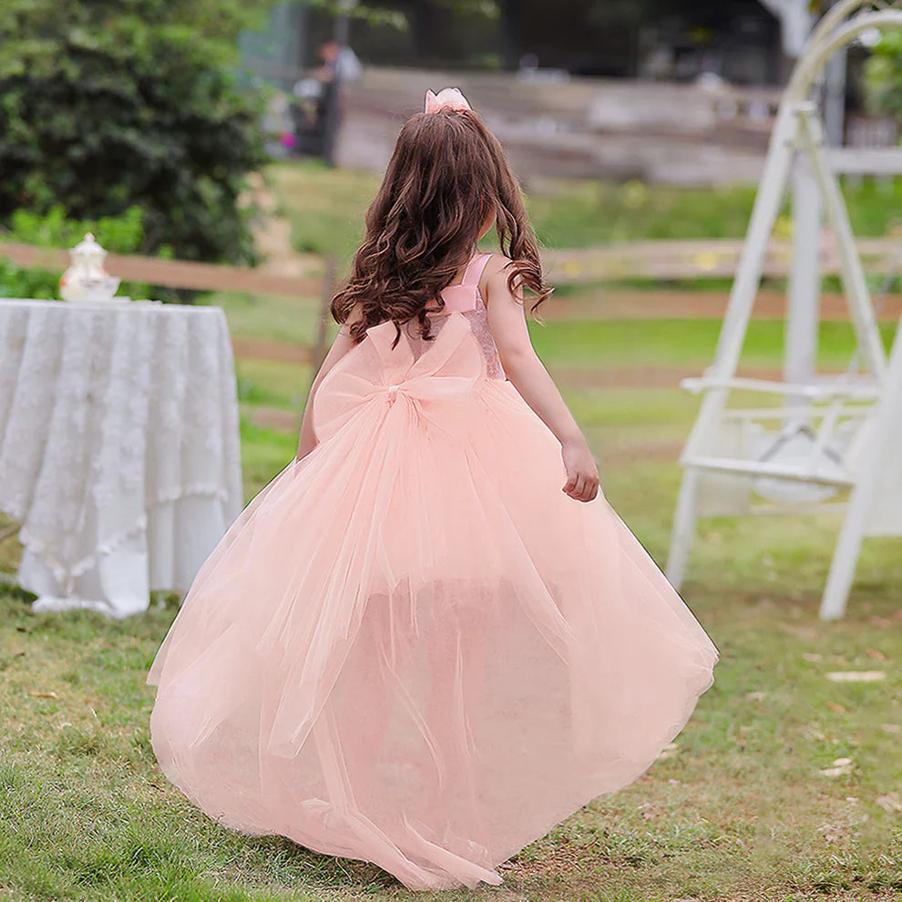 Close-up of the two-piece flower girl dress, highlighting the scoop neckline and bow detail.