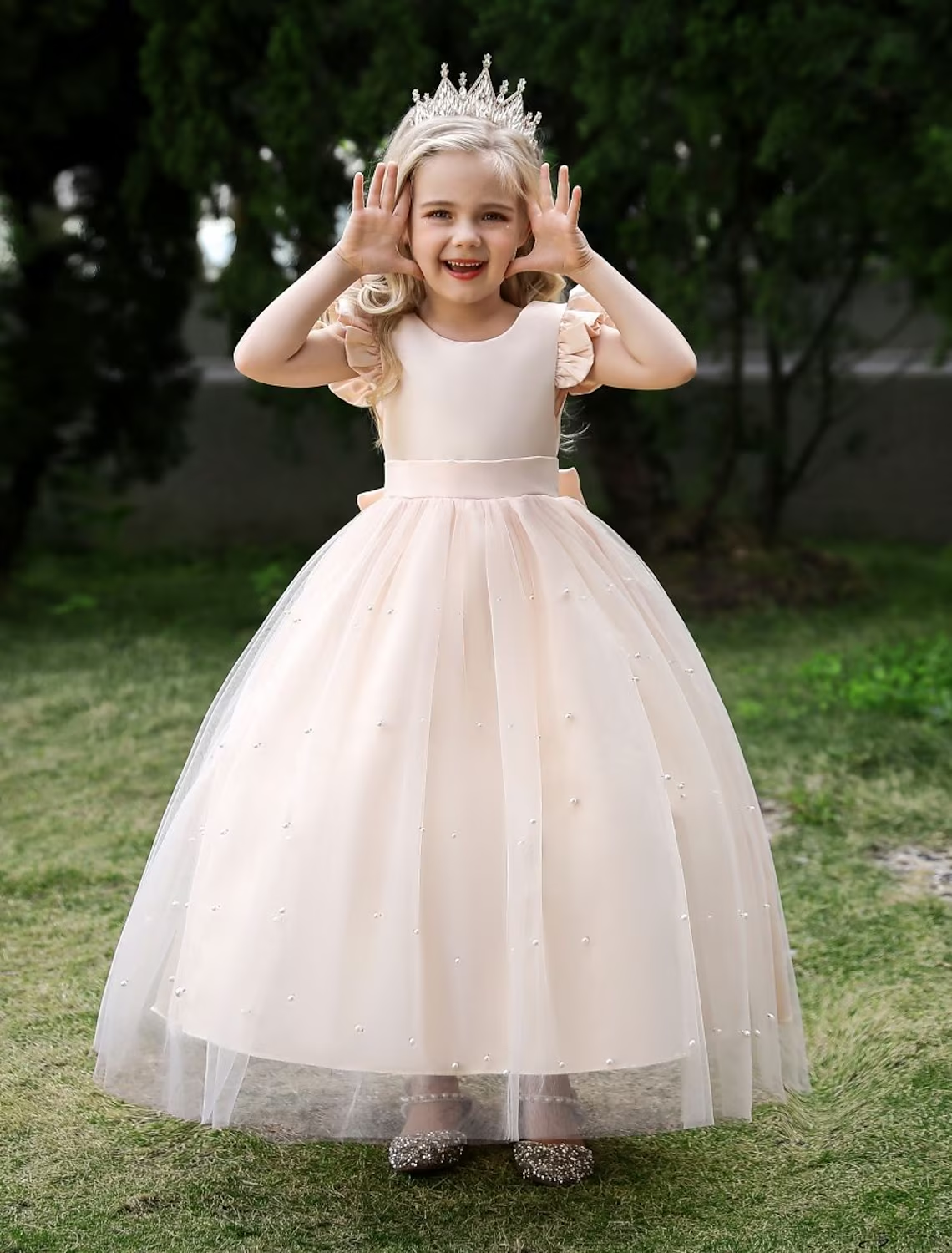 Back view of a girls' sleeveless princess tulle maxi dress.