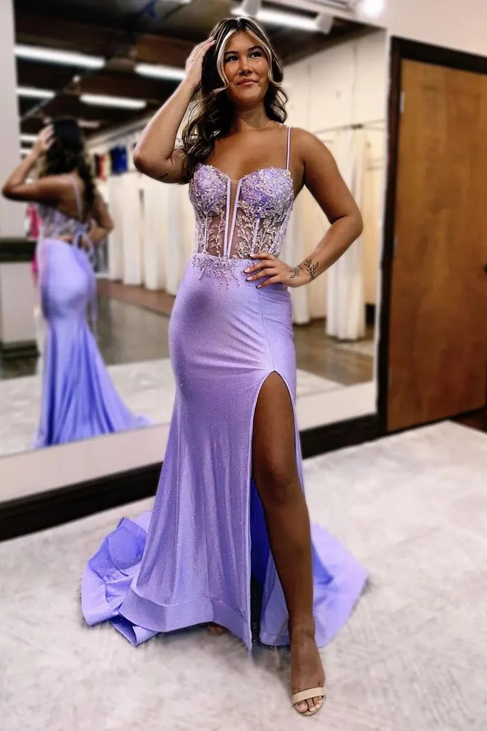 Side view of a model wearing a lilac glitter mermaid dress.
