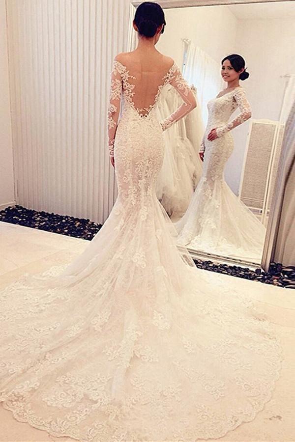 Back view of elegant mermaid bridal gown with lace details.