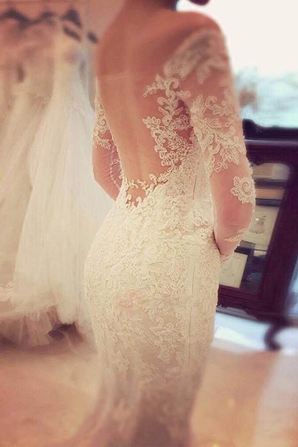 Bride wearing a charming off-shoulder lace mermaid wedding dress.