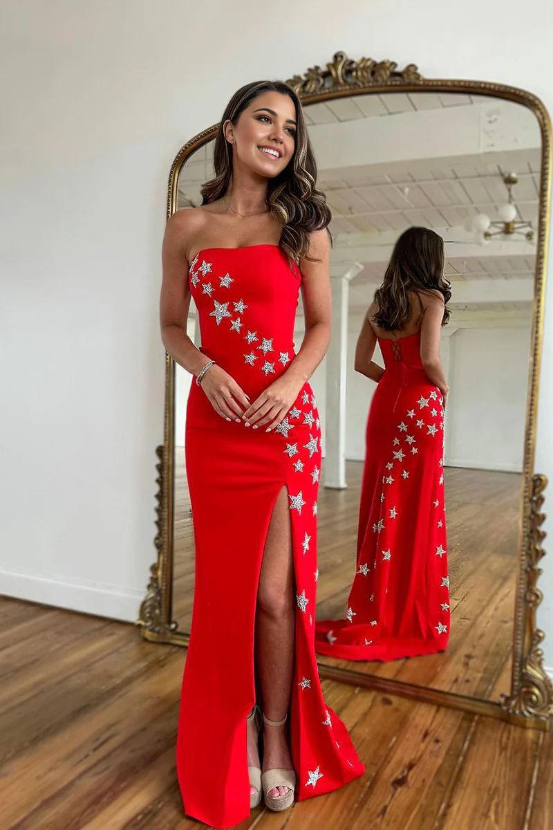 Elegant red satin mermaid prom dress with a strapless neckline and thigh-high slit.