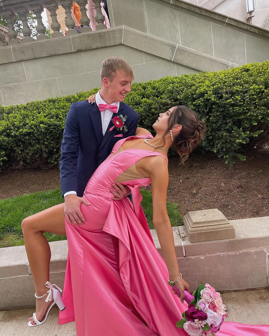 Front view of a pink satin sheath dress.