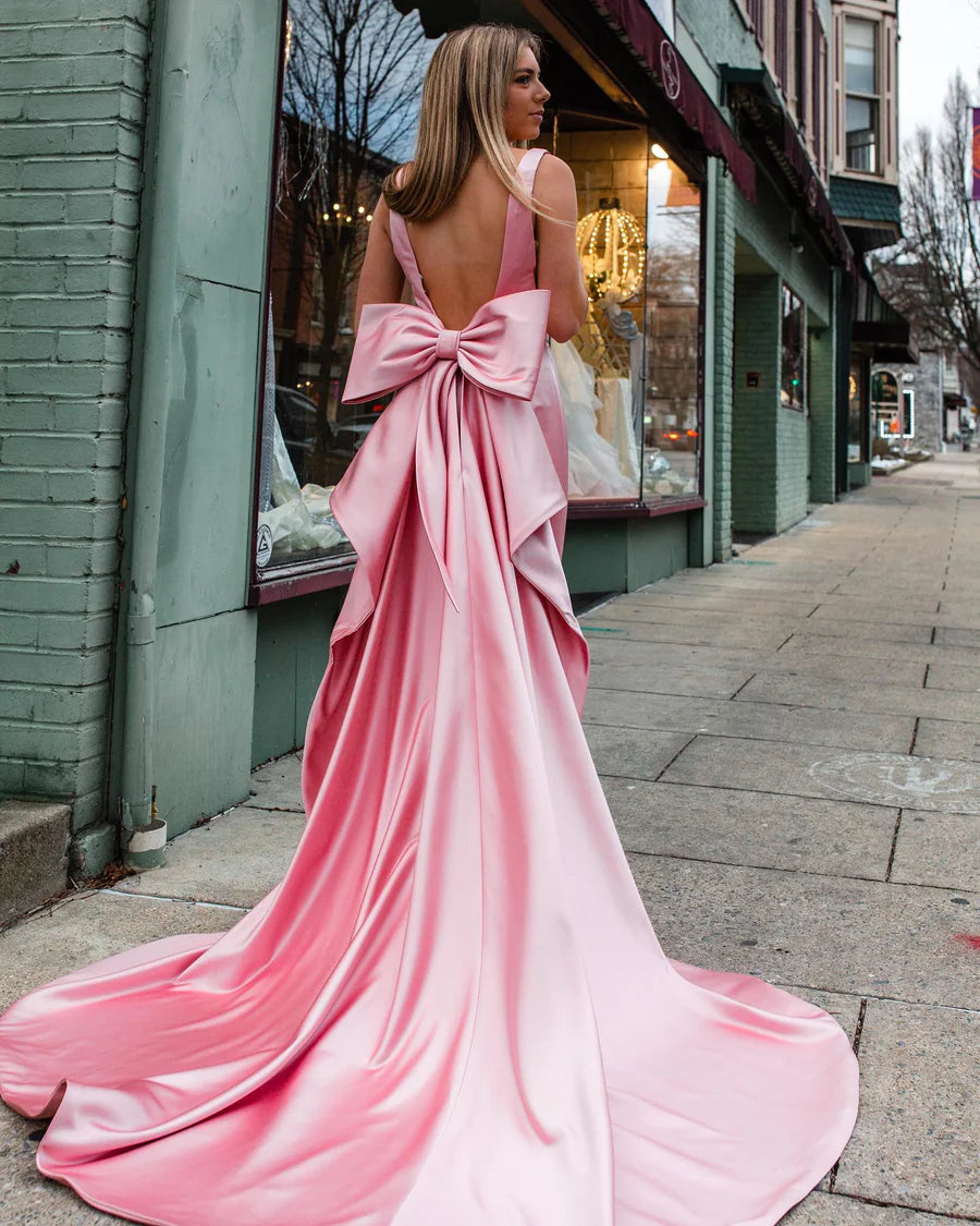 Back view of pink satin dress, showcasing the elegant big bow.