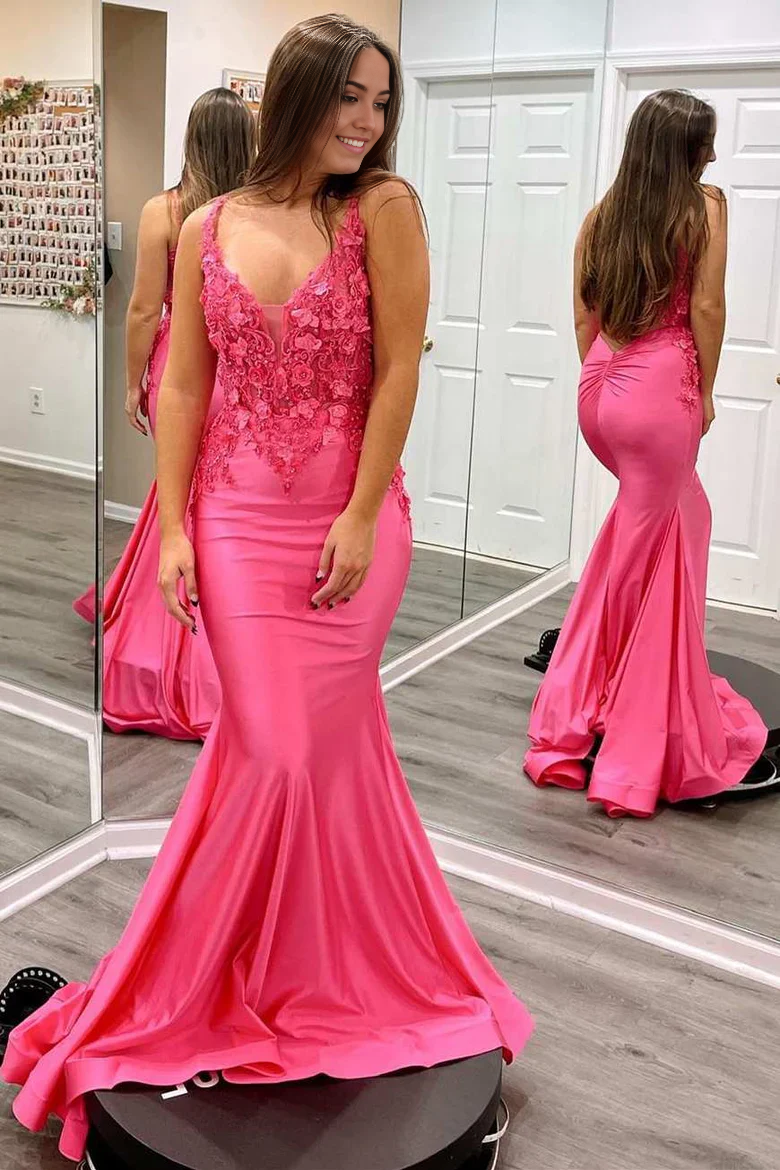 Detail of the appliques on the fuchsia sparkly satin dress.