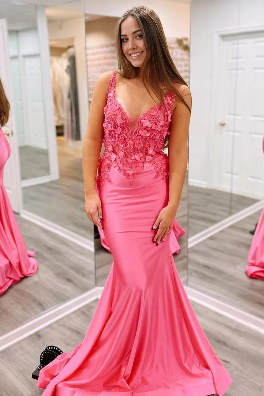 Model wearing the fuchsia sparkly mermaid prom dress, posing elegantly.