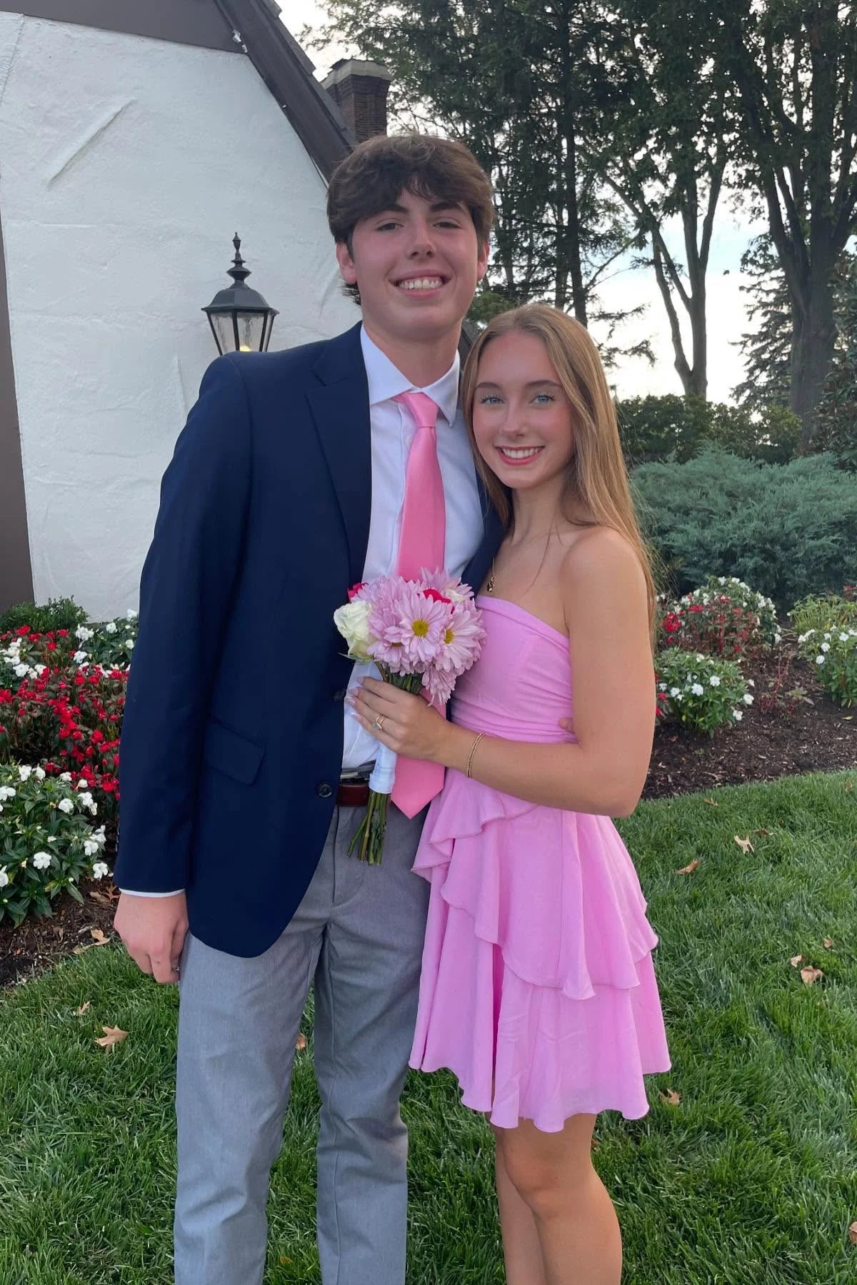 Pink strapless ruffled tiered A-line short dress.