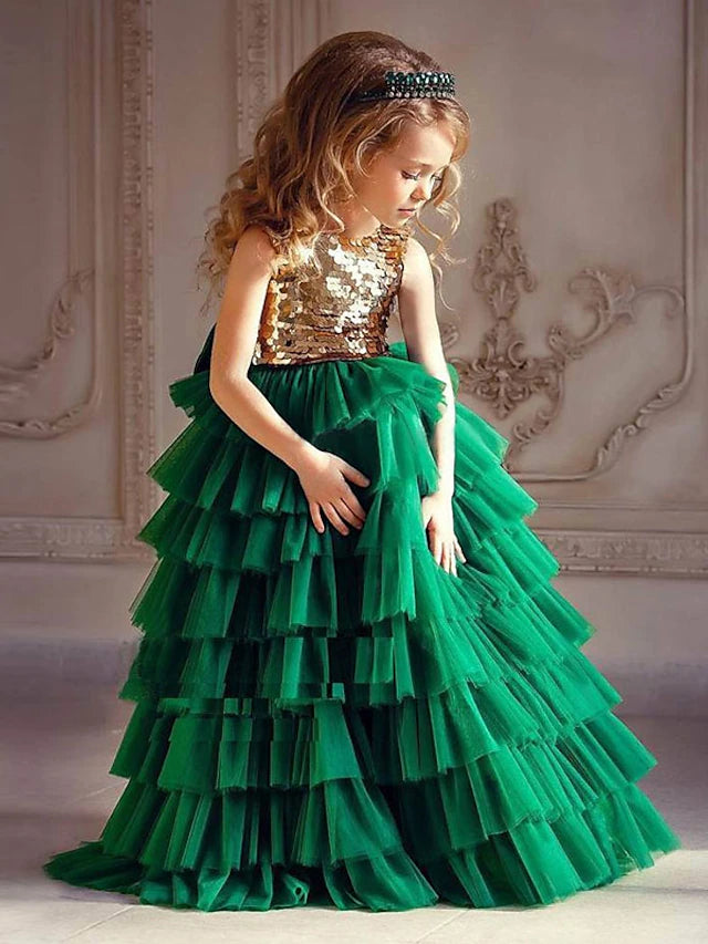Elegant princess tulle flower girl dress with tiered skirt and bow detail.