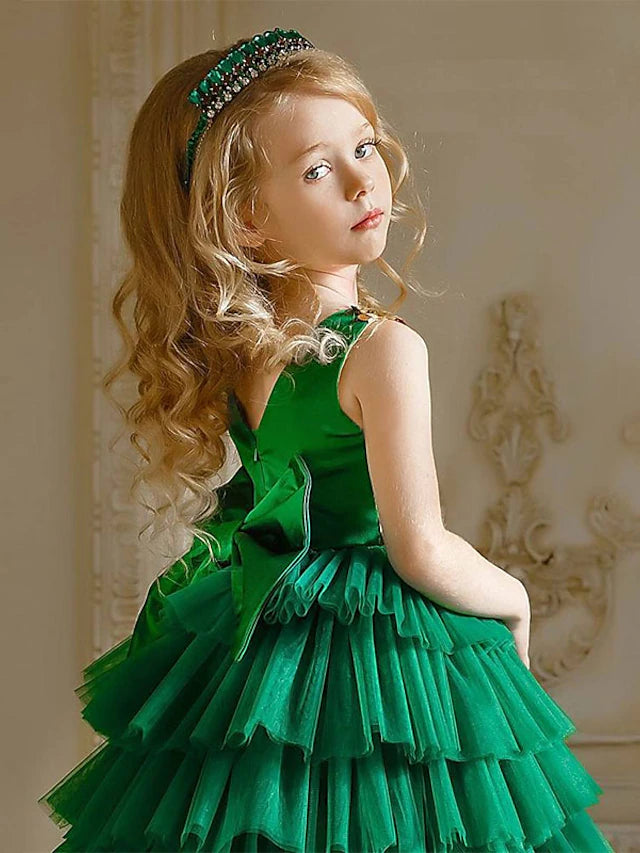 Side view of a charming floor-length tiered tulle dress for girls.