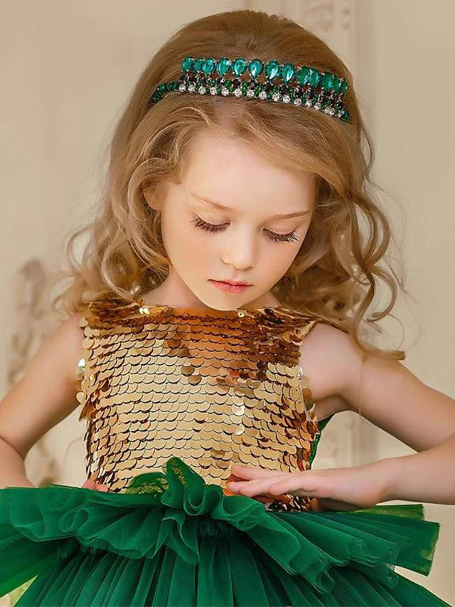 Back view of the festive flower girl gown featuring a large decorative bow.