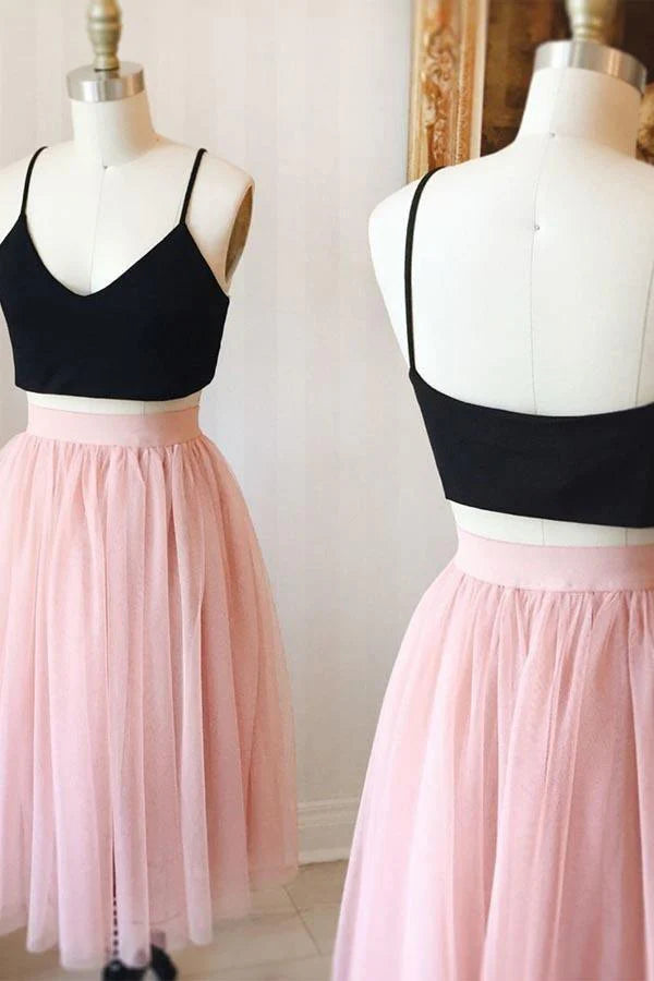 Model wearing a pink two-piece tulle knee-length homecoming dress.