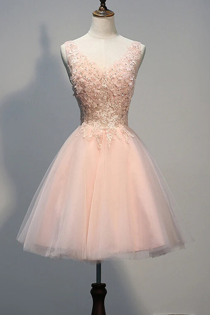 Short pearl pink homecoming dress with open back and appliques.