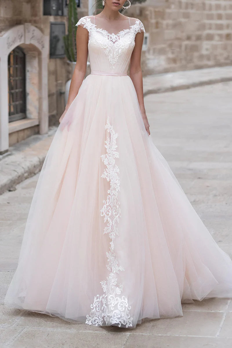Elegant A-line wedding dress with cap sleeves, front view.