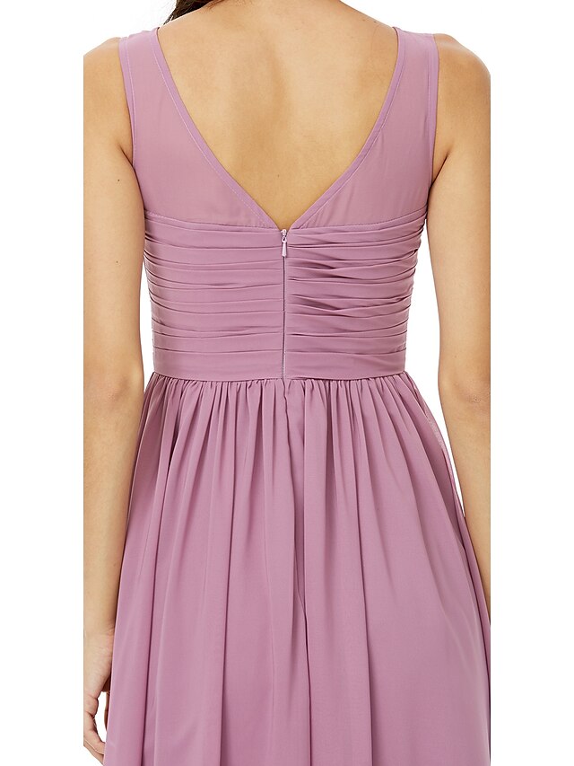 Side profile of the floor-length A-Line chiffon dress with flowing skirt.