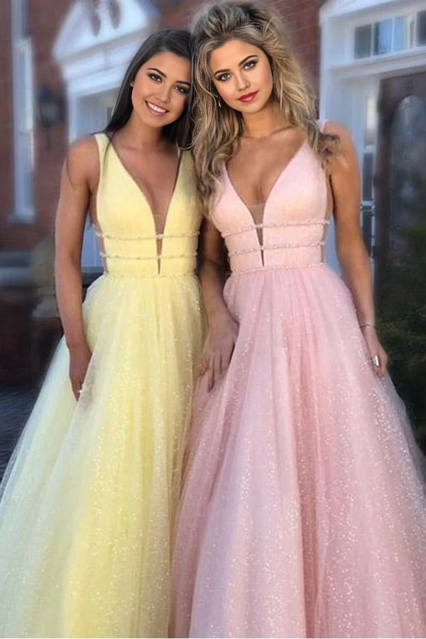 Pink A-line prom dress with deep V-neck, beading, and sweep train, front view.