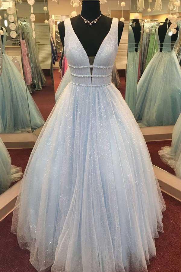 Back view of a pink backless A-line prom dress with a sweep train.