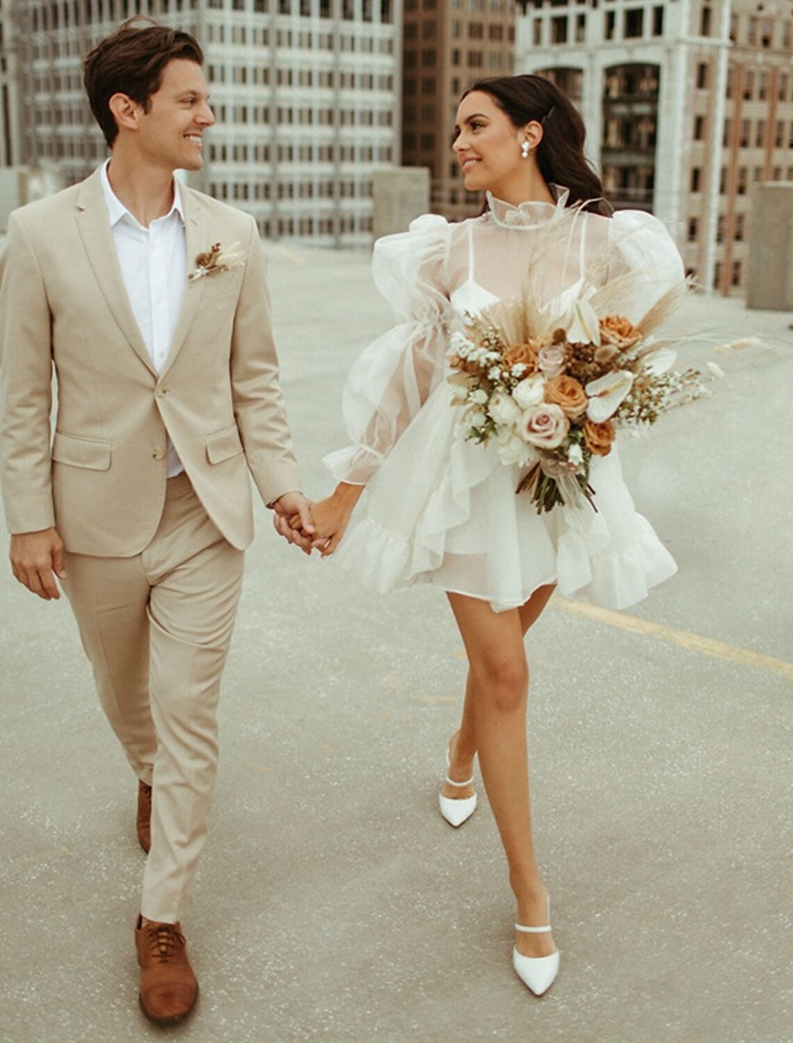 Full view of the A-line high neck long sleeve organza mini wedding reception dress.
