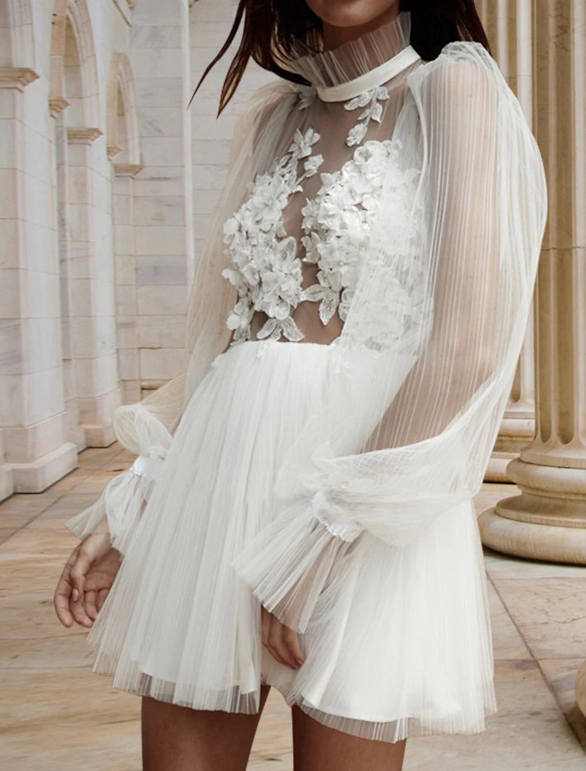 Full length view of white high neck long sleeve mini dress.