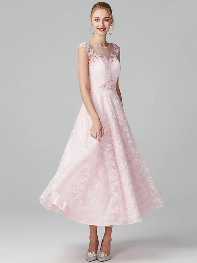 Close-up of the illusion neckline and short sleeves of the A-line floral lace dress.
