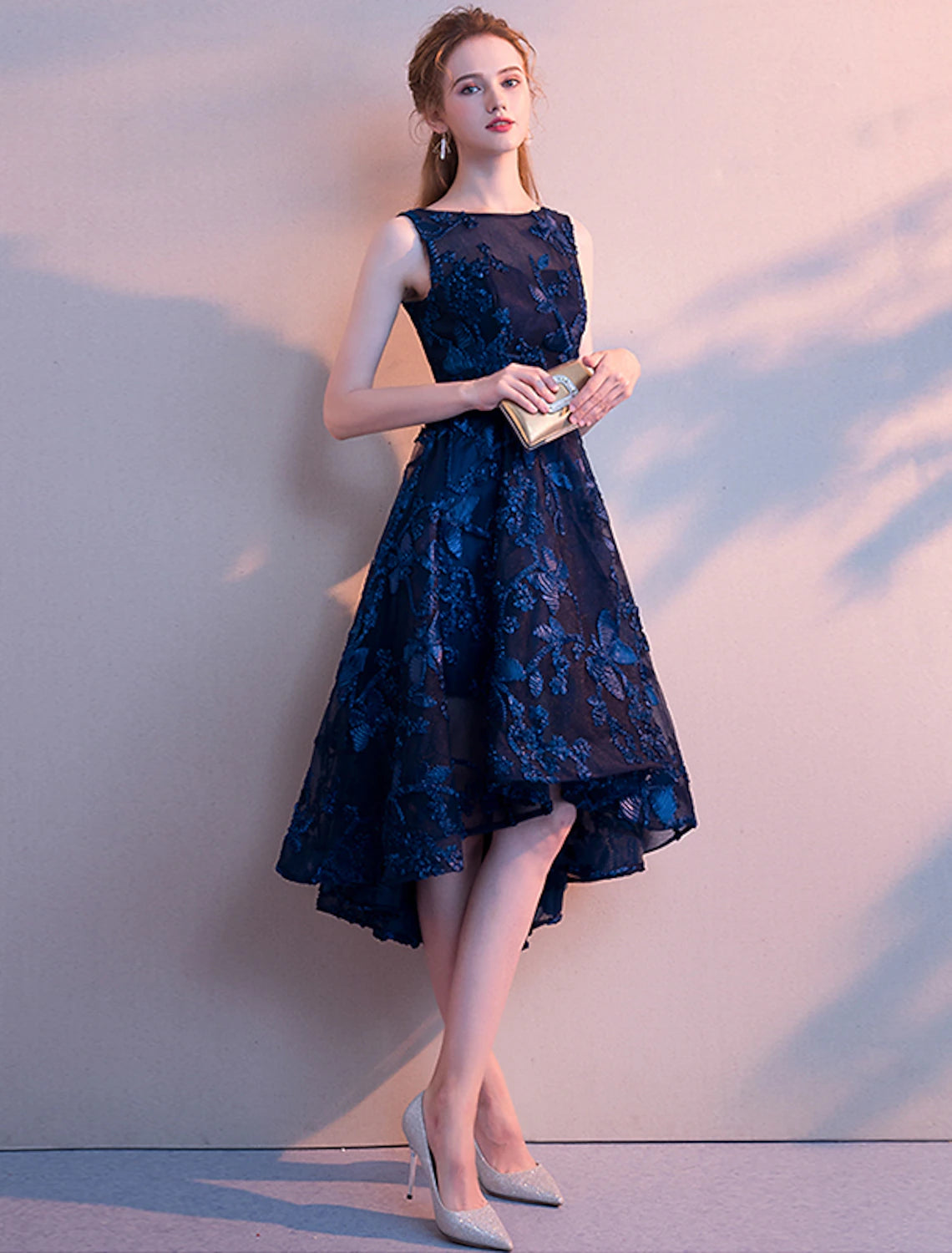 Side view of elegant teal pleated dress.