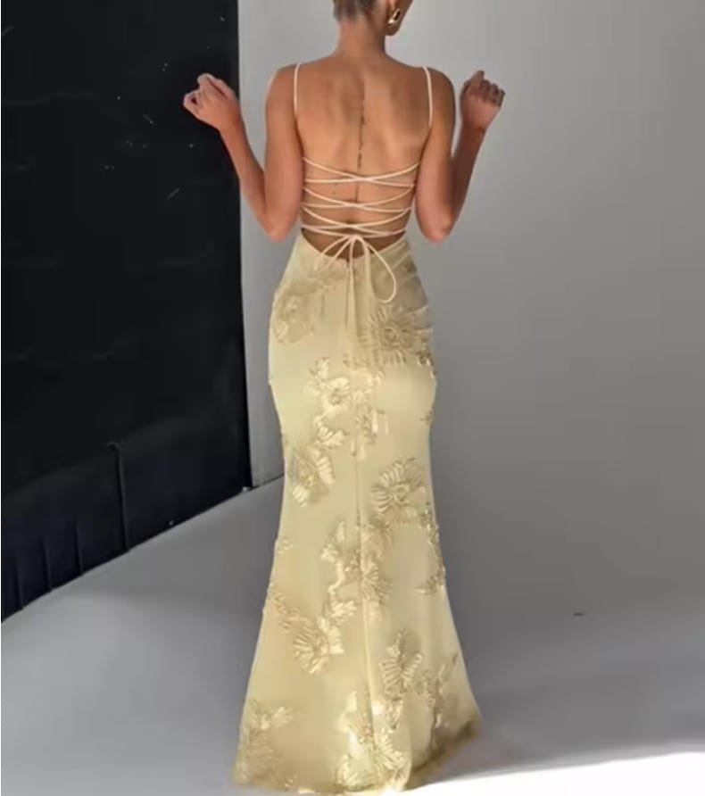 Back view of the chic floral maxi gown, showcasing the backless design.