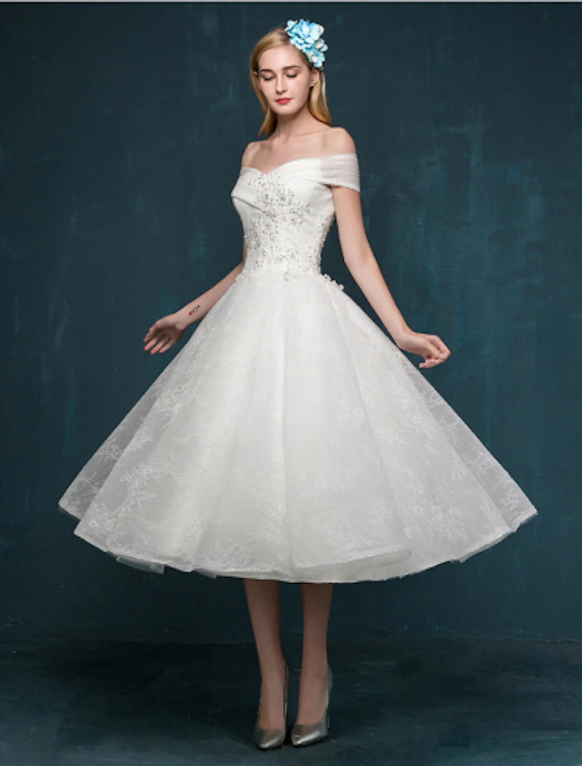 Full view of the white A-Line off-shoulder cap sleeve dress.