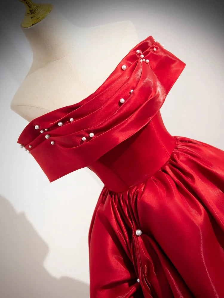 Side view of the flowing A-line off-shoulder satin long prom dress.