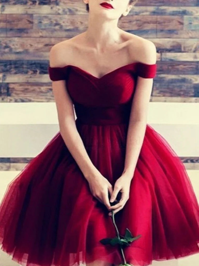 Woman wearing a chic A-line off-shoulder short prom dress.