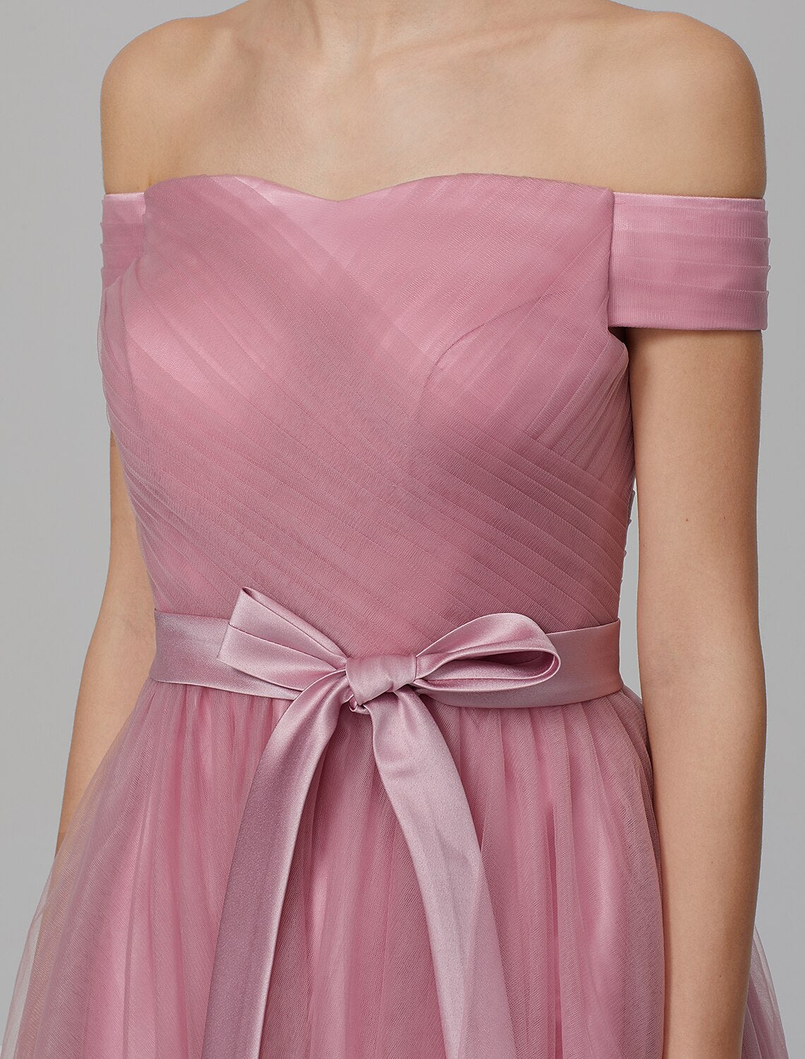 Bridesmaid dress showing the elegant A-line silhouette and side draping.