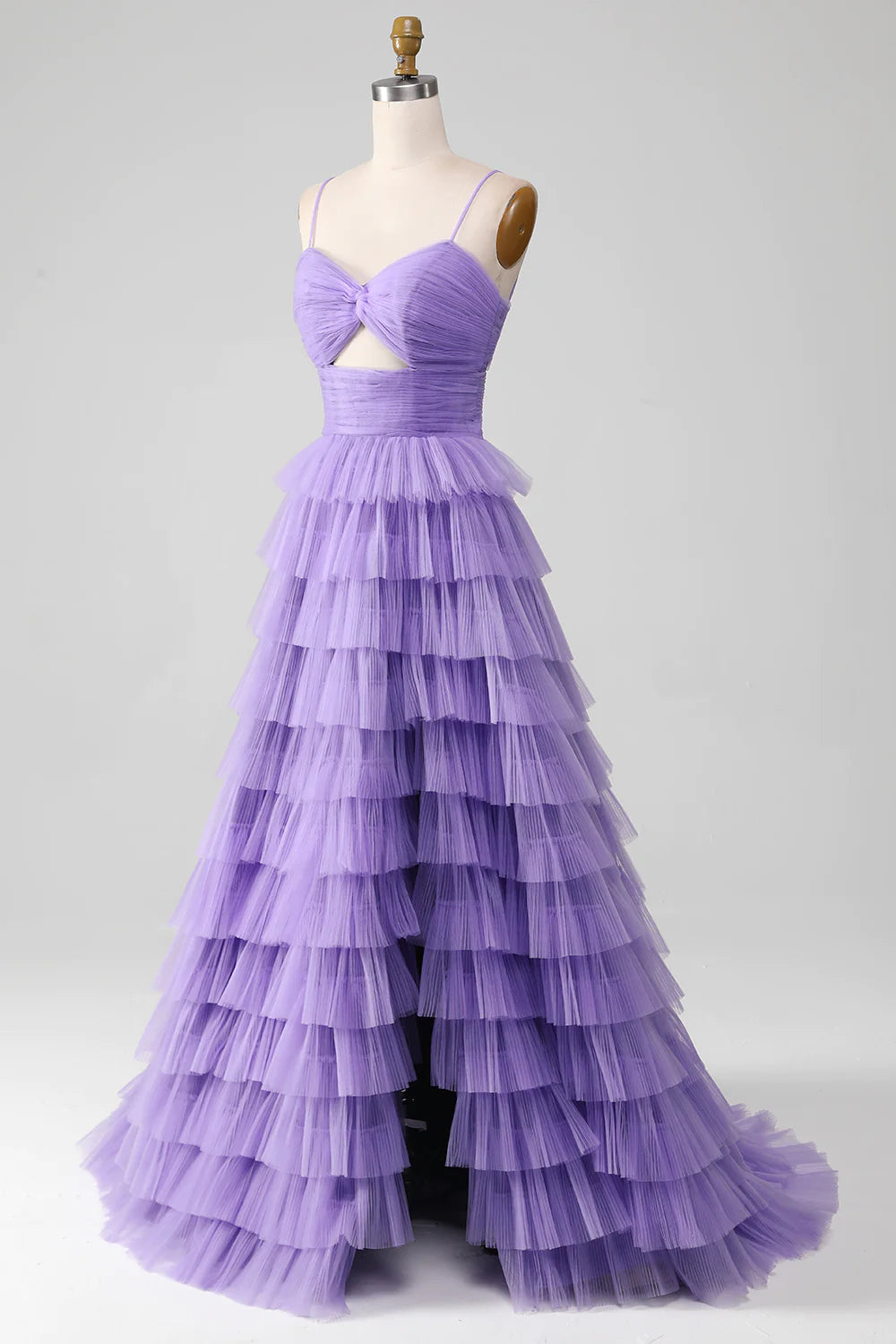 Model wearing a purple A-line off-shoulder tulle prom dress with a high slit.