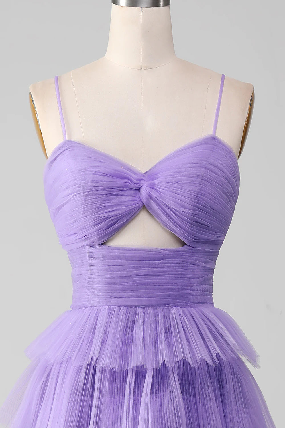Back view of a model in an elegant purple tulle off-shoulder gown.