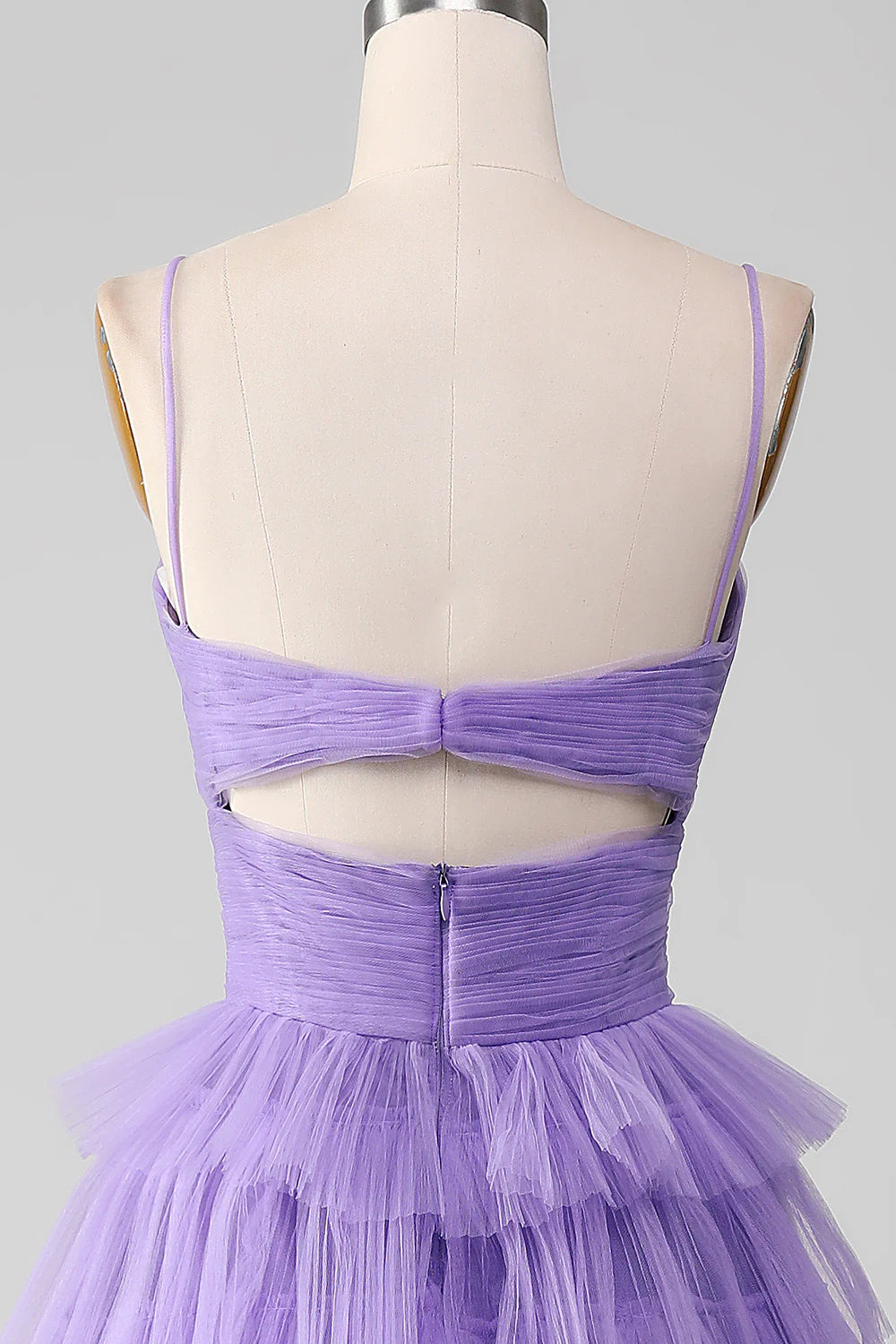 Close-up of the off-shoulder neckline and tulle fabric of the purple dress.